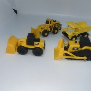 2 plastic Cat contruction toys, One Cat Hauler Truck and One Metal 988B Loader